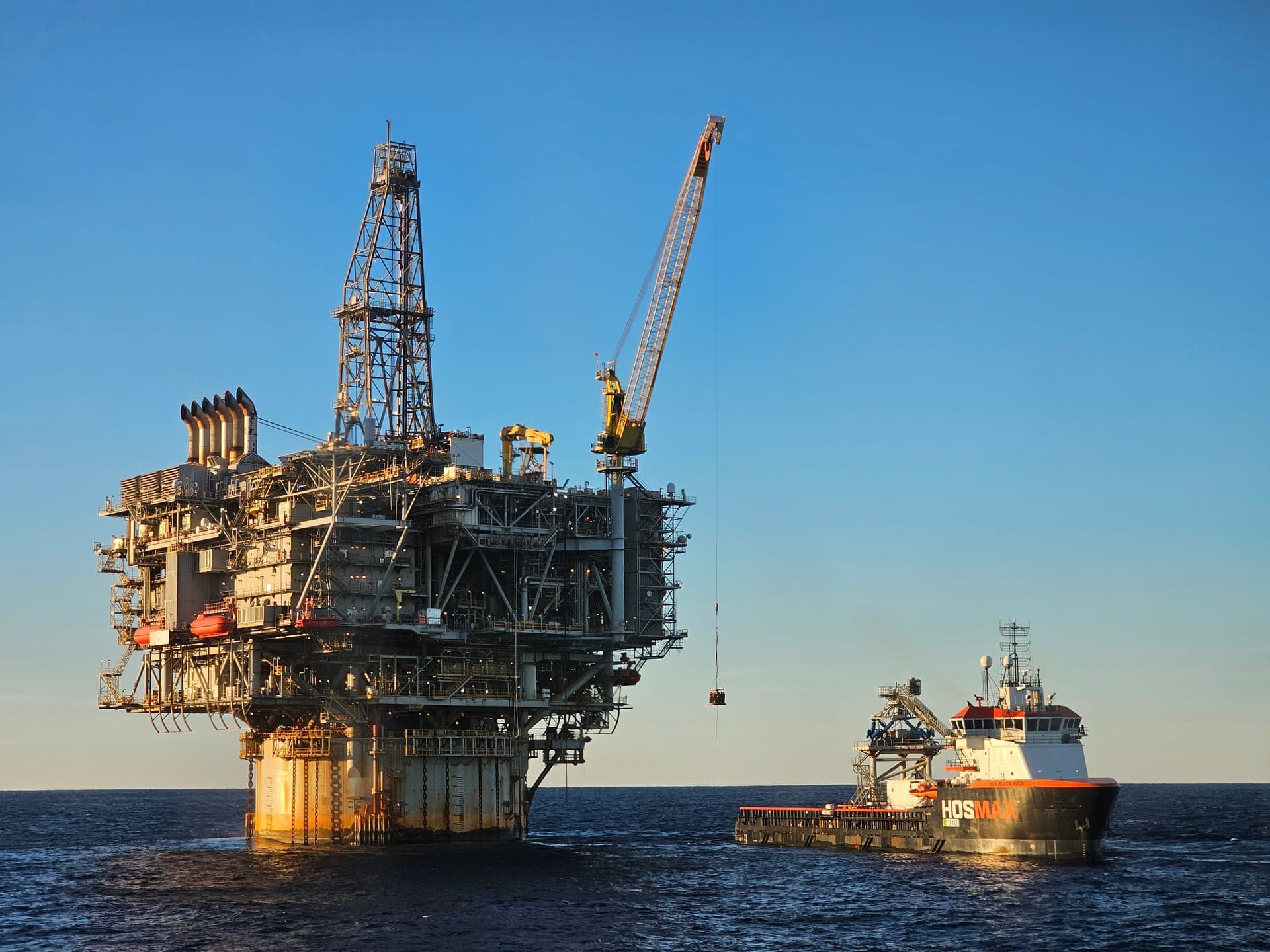 Offshore oil platform with a supply vessel alongside
